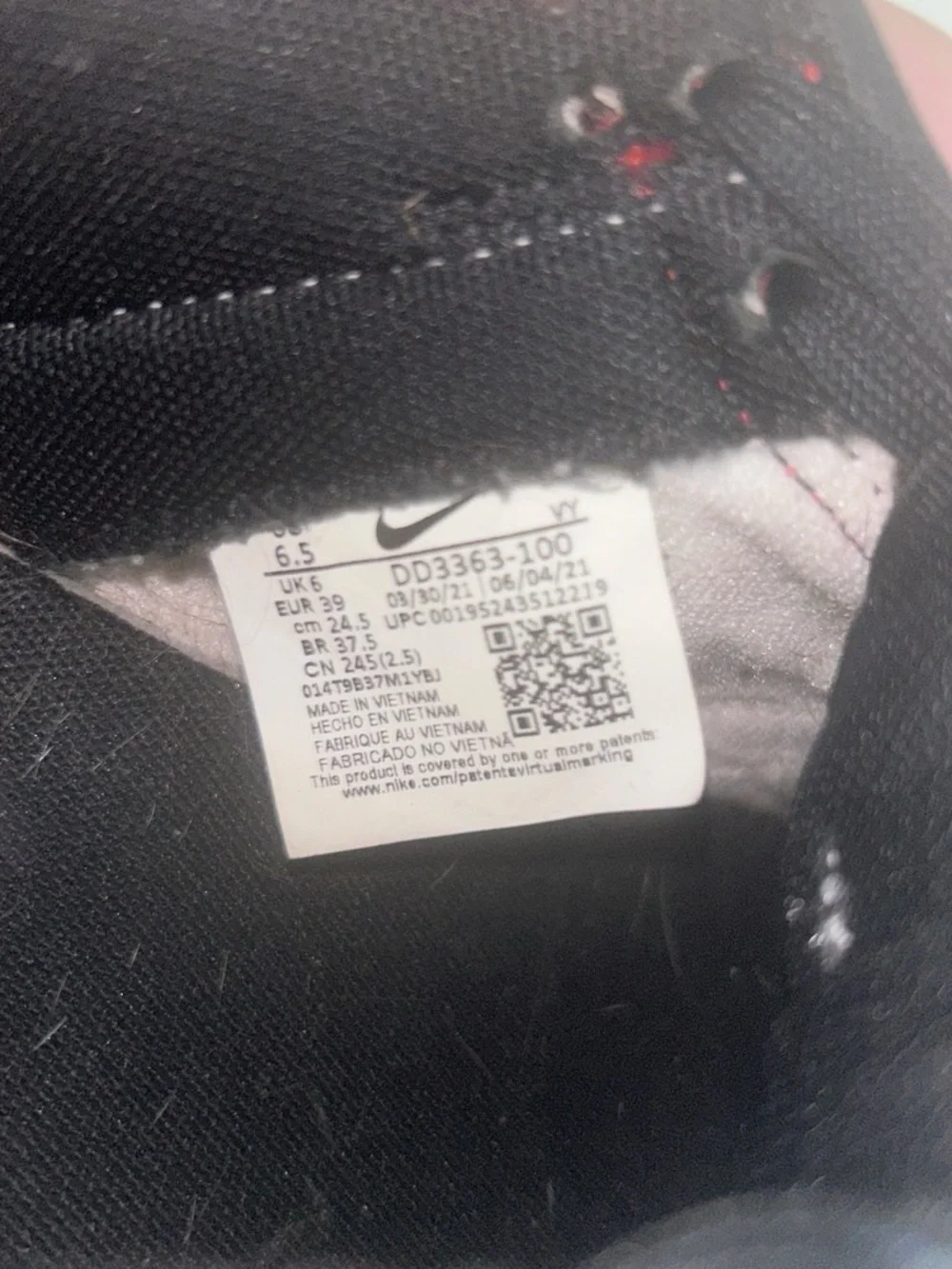 Nike Black and Red Athletic Sneaker Interior Label Visible